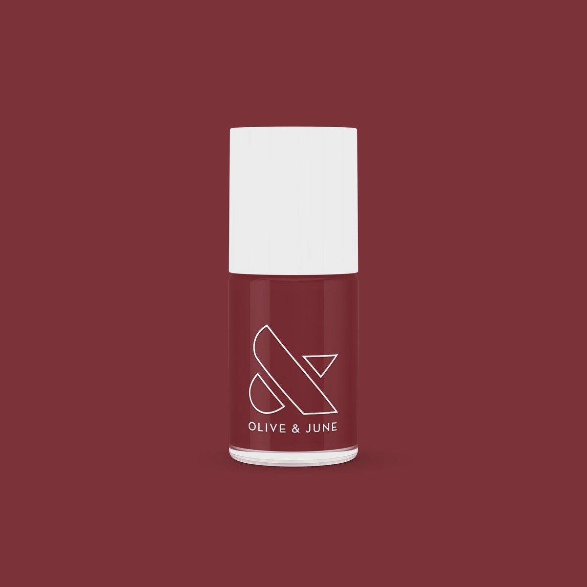 Bottle of JJ nail polish by Olive and June in a rich cinnamon brown shade for at-home manicures and pedis